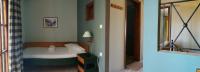 A bed or beds in a room at Lakonia Bay Apartments