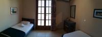A bed or beds in a room at Lakonia Bay Apartments