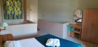 A bed or beds in a room at Lakonia Bay Apartments