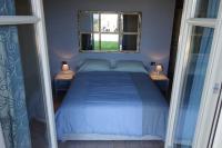 A bed or beds in a room at Locanda degli Ultimi
