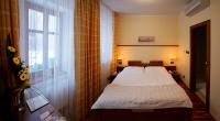 Postel nebo postele na pokoji v ubytování Hotel Penzion Na Hradě
