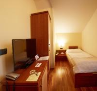 Postel nebo postele na pokoji v ubytování Hotel Penzion Na Hradě
