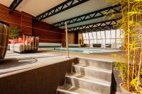 a swimming pool with stairs leading to a house at Le Grand Tétras in Font-Romeu