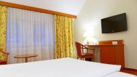 TV a/nebo společenská místnost v ubytování Central Hotel Löwen