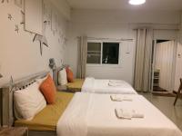 Postel nebo postele na pokoji v ubytování Norn Nab Dao RimPhu Resort
