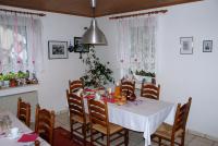 a dining room with a white table and chairs at Landhotel Lützen-Stadt in Lützen