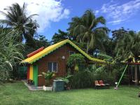 a small house with a colorful roof at Fetay Jaune in Baie-Mahault