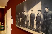 an old photo of a group of men on a wall at OFFICINA TESINI Guest Rooms Verona in Verona