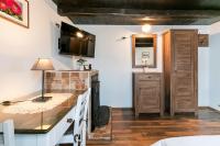 Televízia a/alebo spoločenská miestnosť v ubytovaní Holiday home Podgaj