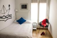 A bed or beds in a room at Balenax Pensión