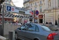 a car parked on a street with a street sign at Hôtel Saint-Julien in Angers