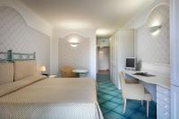 Posteľ alebo postele v izbe v ubytovaní Hotel Santa Gilla
