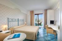 Posteľ alebo postele v izbe v ubytovaní Hotel Santa Gilla