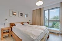 Posteľ alebo postele v izbe v ubytovaní The Darling Nadmorze by Baltica Apartments