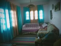Postel nebo postele na pokoji v ubytování Rural Guest House فندق البيت الريفي
