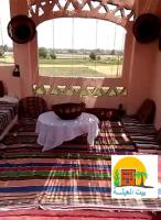 Postel nebo postele na pokoji v ubytování Rural Guest House فندق البيت الريفي