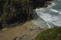 an aerial view of a beach with the ocean at The Olde Malthouse Inn in Tintagel