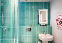 a bathroom with a sink and a toilet and a mirror at ABode Manchester in Manchester