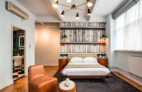 a bedroom with a bed and a chair at ABode Manchester in Manchester