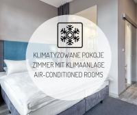 Łóżko lub łóżka w pokoju w obiekcie Hotel Kaliski