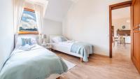 Posteľ alebo postele v izbe v ubytovaní Apartamenty Sun & Snow Rezydencja Park
