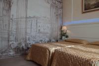 Łóżko lub łóżka w pokoju w obiekcie Hotel Palladium Palace