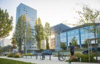 a man running on a sidewalk in front of a building at Résidence Odalys Nantes Cité des Congrès in Nantes