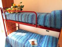 A bed or beds in a room at Andrea