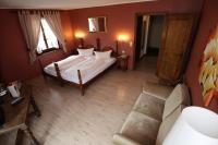 Postel nebo postele na pokoji v ubytování Schwarzwaldhotel Stollen