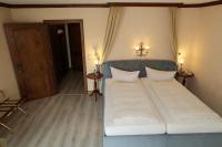 Postel nebo postele na pokoji v ubytování Schwarzwaldhotel Stollen