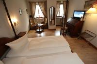 Postel nebo postele na pokoji v ubytování Schwarzwaldhotel Stollen