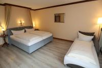 Postel nebo postele na pokoji v ubytování Schwarzwaldhotel Stollen