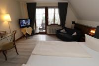 Postel nebo postele na pokoji v ubytování Schwarzwaldhotel Stollen