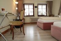 Postel nebo postele na pokoji v ubytování Schwarzwaldhotel Stollen
