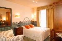 Postel nebo postele na pokoji v ubytování Hotel Avenida Real