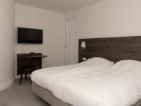 Een bed of bedden in een kamer bij Hotel-Restaurant Het Rechthuis