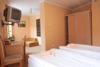 Łóżko lub łóżka w pokoju w obiekcie Hotel Zamek