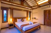Postel nebo postele na pokoji v ubytování Lanta Miami Resort - SHA Extra Plus