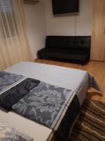 Posteľ alebo postele v izbe v ubytovaní Apartman Centros