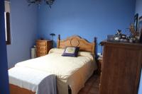A bed or beds in a room at Casa Clotilde