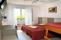 Posteľ alebo postele v izbe v ubytovaní Hotel Zenith