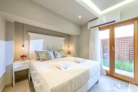 Postel nebo postele na pokoji v ubytování Candia Suites & Rooms