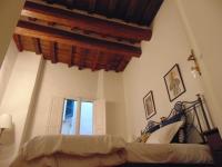 Posteľ alebo postele v izbe v ubytovaní Dante's Rooms