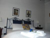 Posteľ alebo postele v izbe v ubytovaní Dante's Rooms