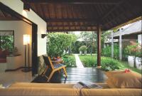 a living room with a couch and a chair at Qunci Villas Resort in Senggigi
