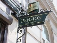 a sign for a cafe karma on the side of a building at Pension Karina Schwerin in Schwerin