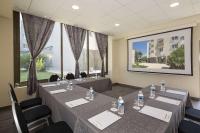 a conference room with tables and chairs and windows at Best Western PLUS Elixir Grasse in Grasse