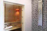 a bathroom with a shower and a sink and a tub at Best Western PLUS Elixir Grasse in Grasse