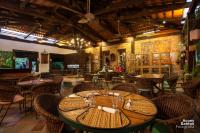a restaurant with tables and chairs in a room at Hotel de Lençois in Lençóis