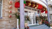a house with decorations on the front of it at See Starsea Guest House in Magong